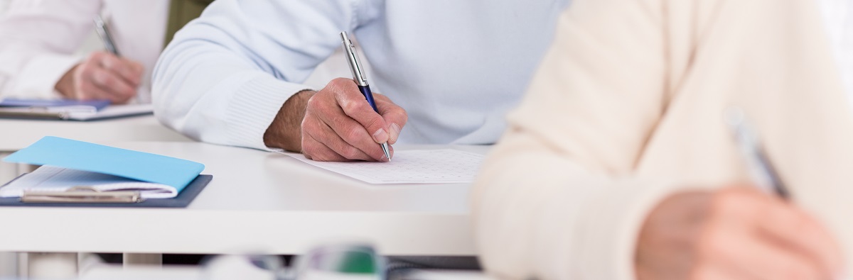 Students hands during writing exam