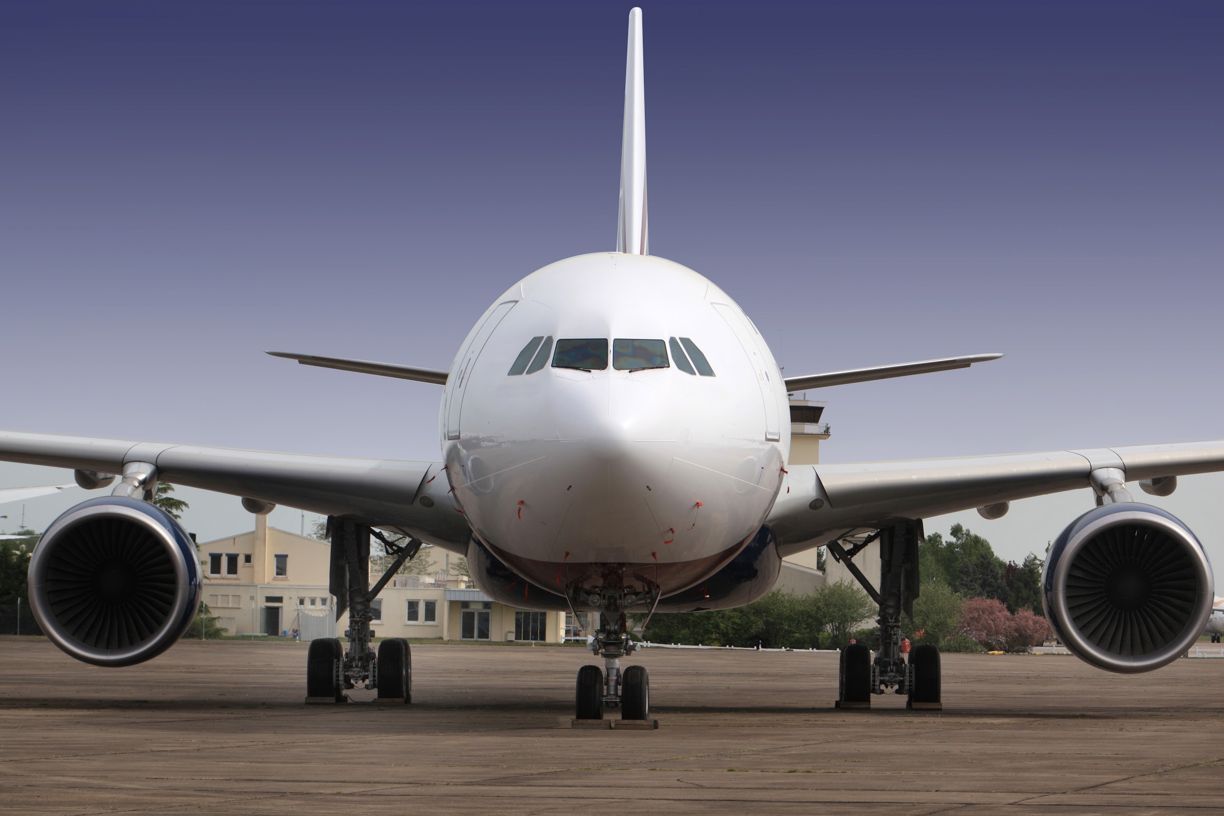 white airplane on airport