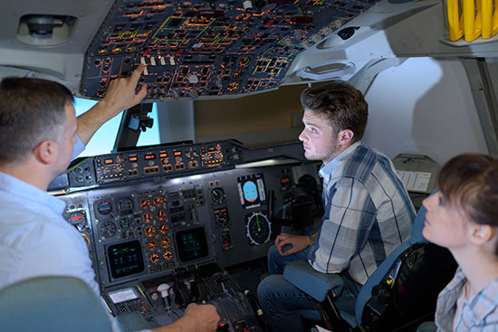 young people learning about aircraft controls