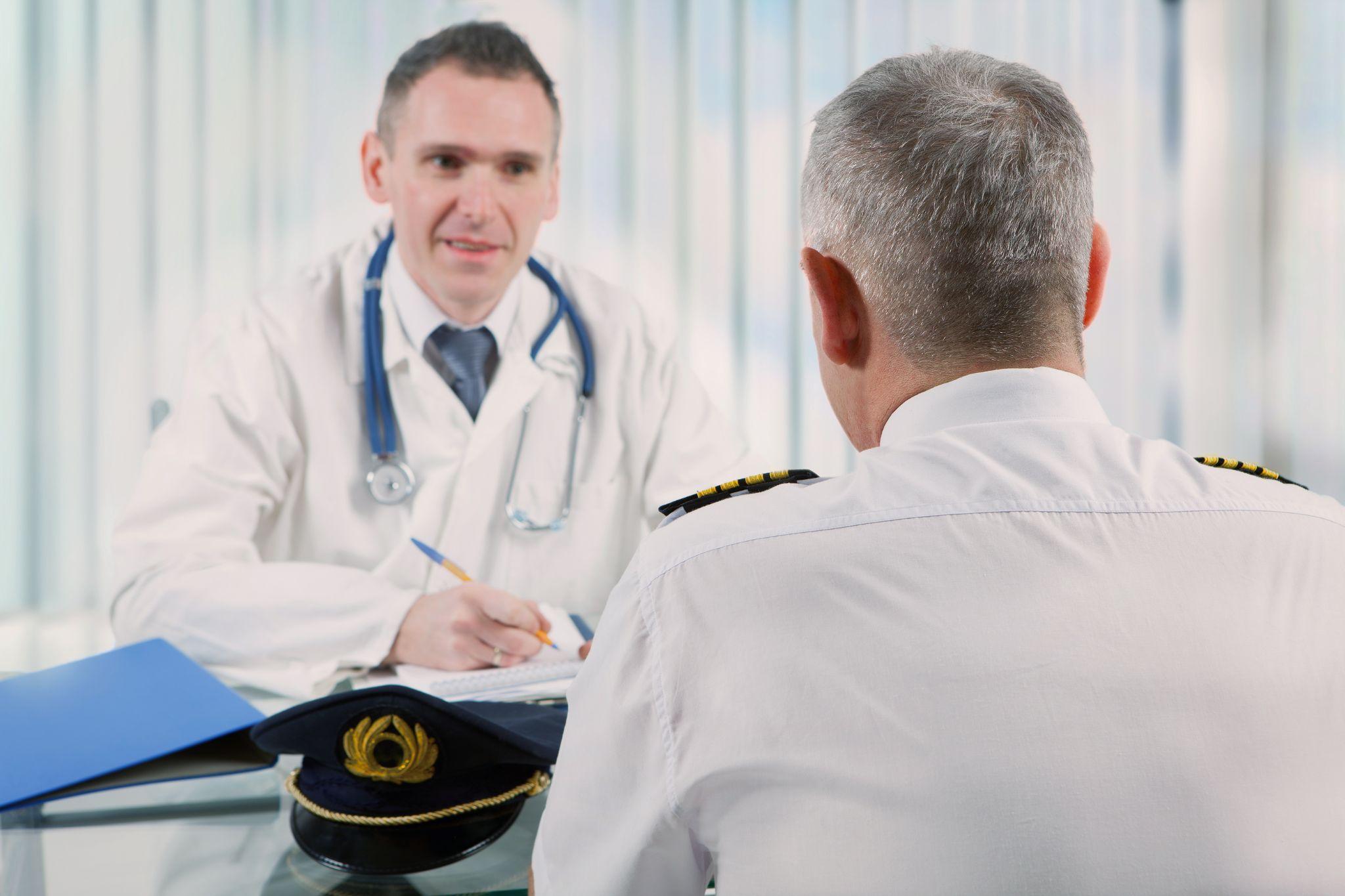 Airplane pilot during medical exam with doctor 