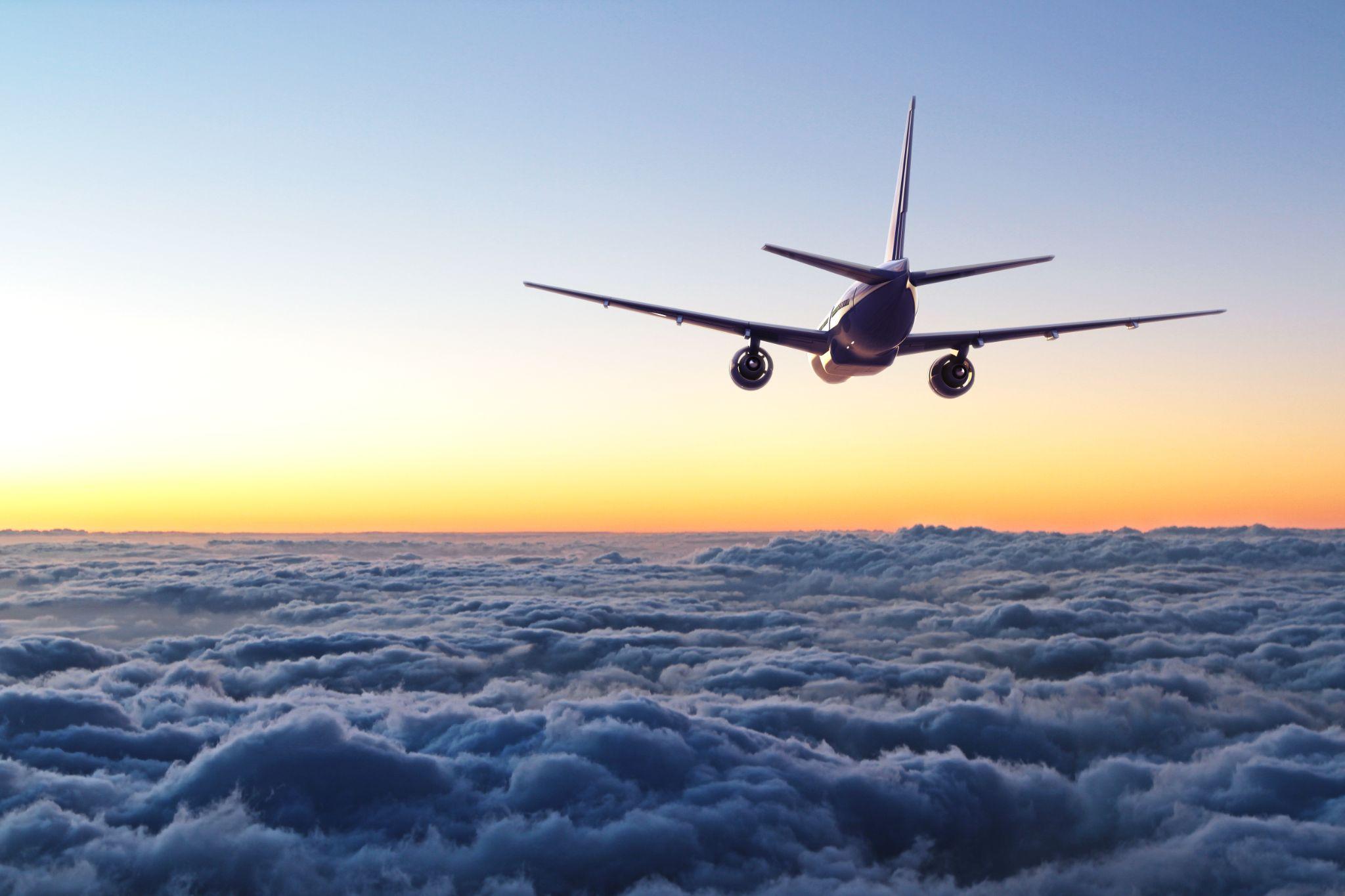 Plane flying away in the sky