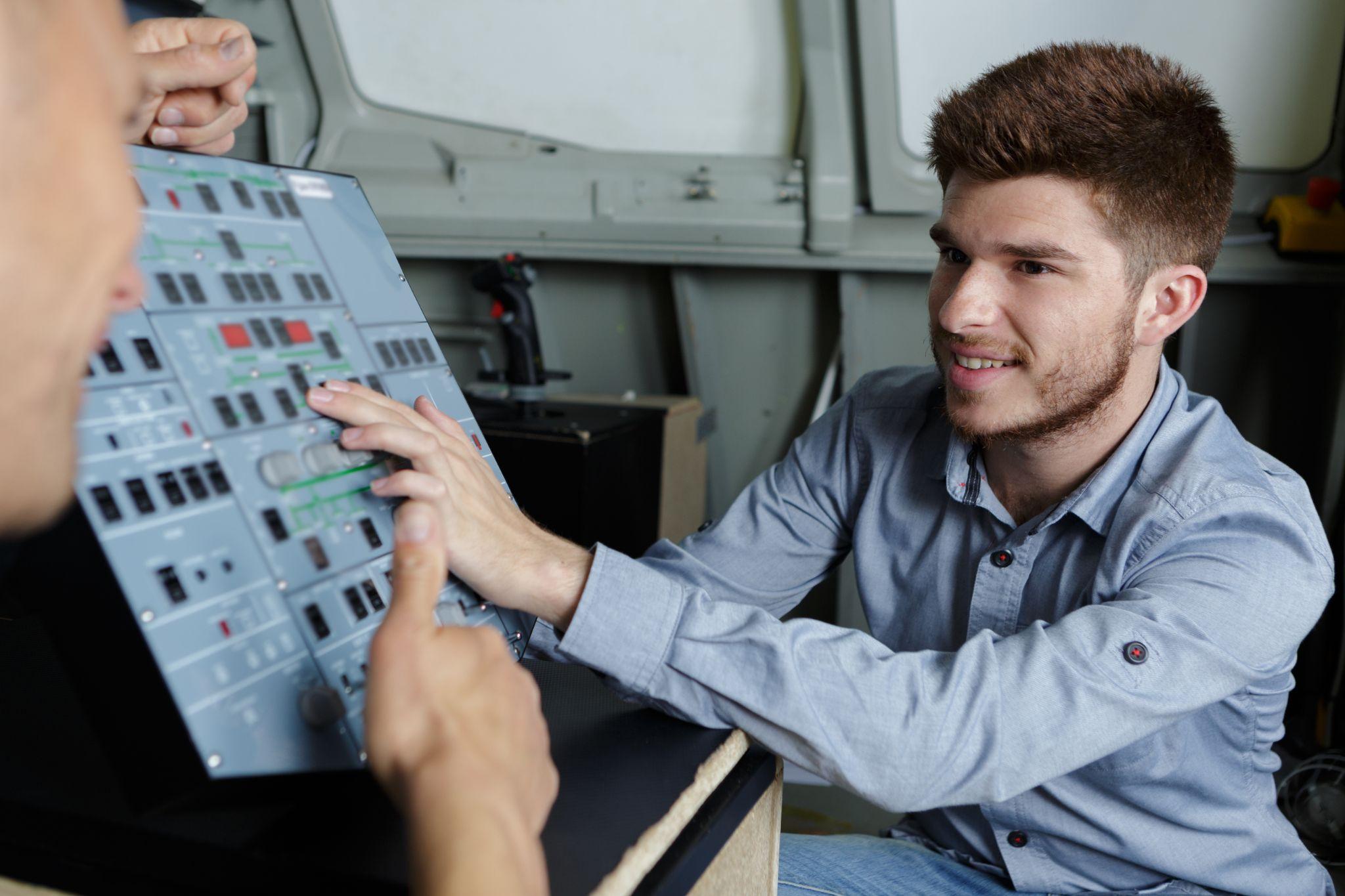 young man in flight simulator for the training pilots