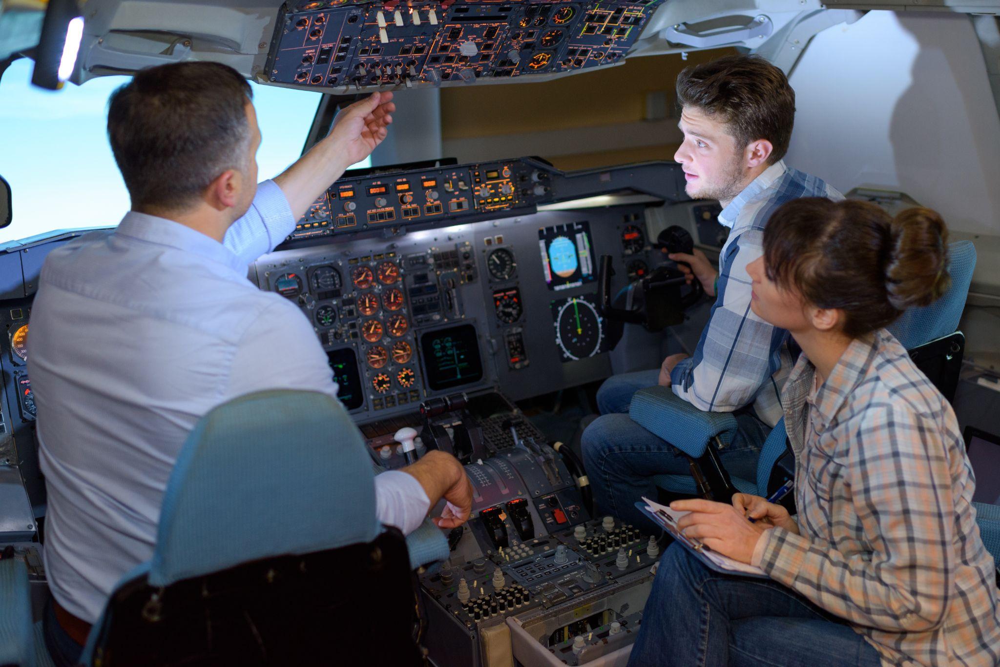 young students learning about aircraft controls