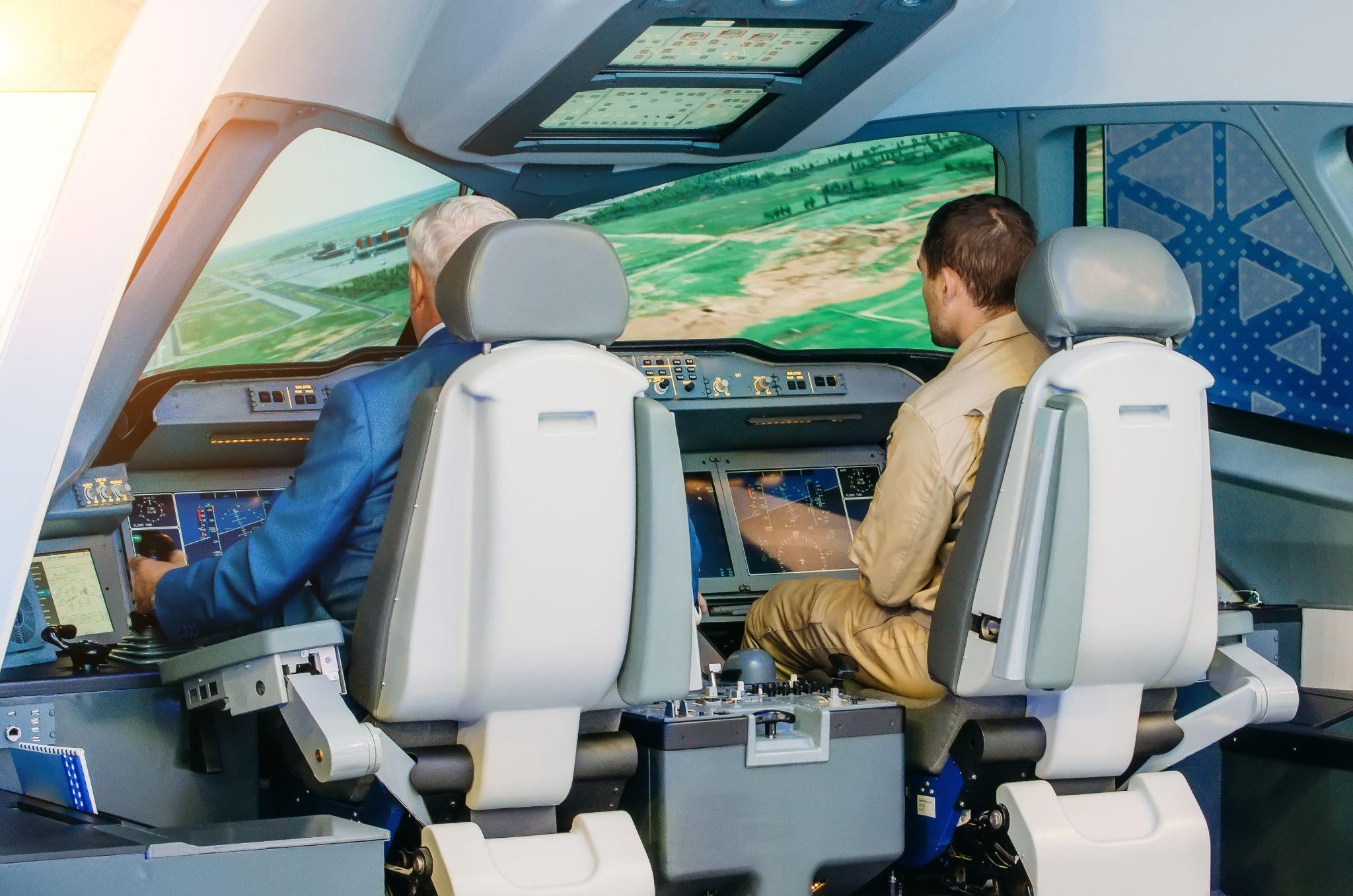 The simulator of a passenger aircraft with a cockpit and pilots