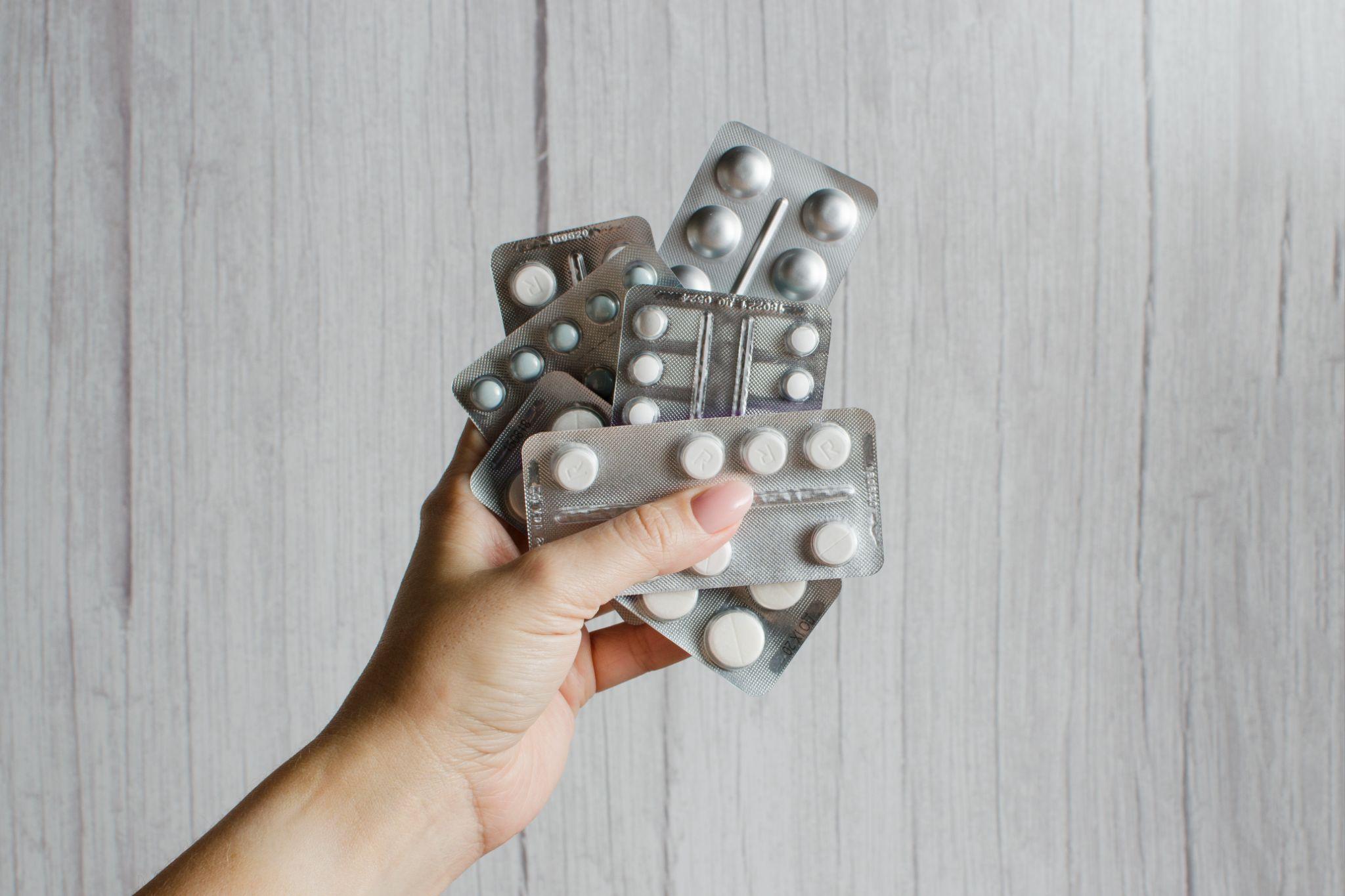 Woman's hand with pills