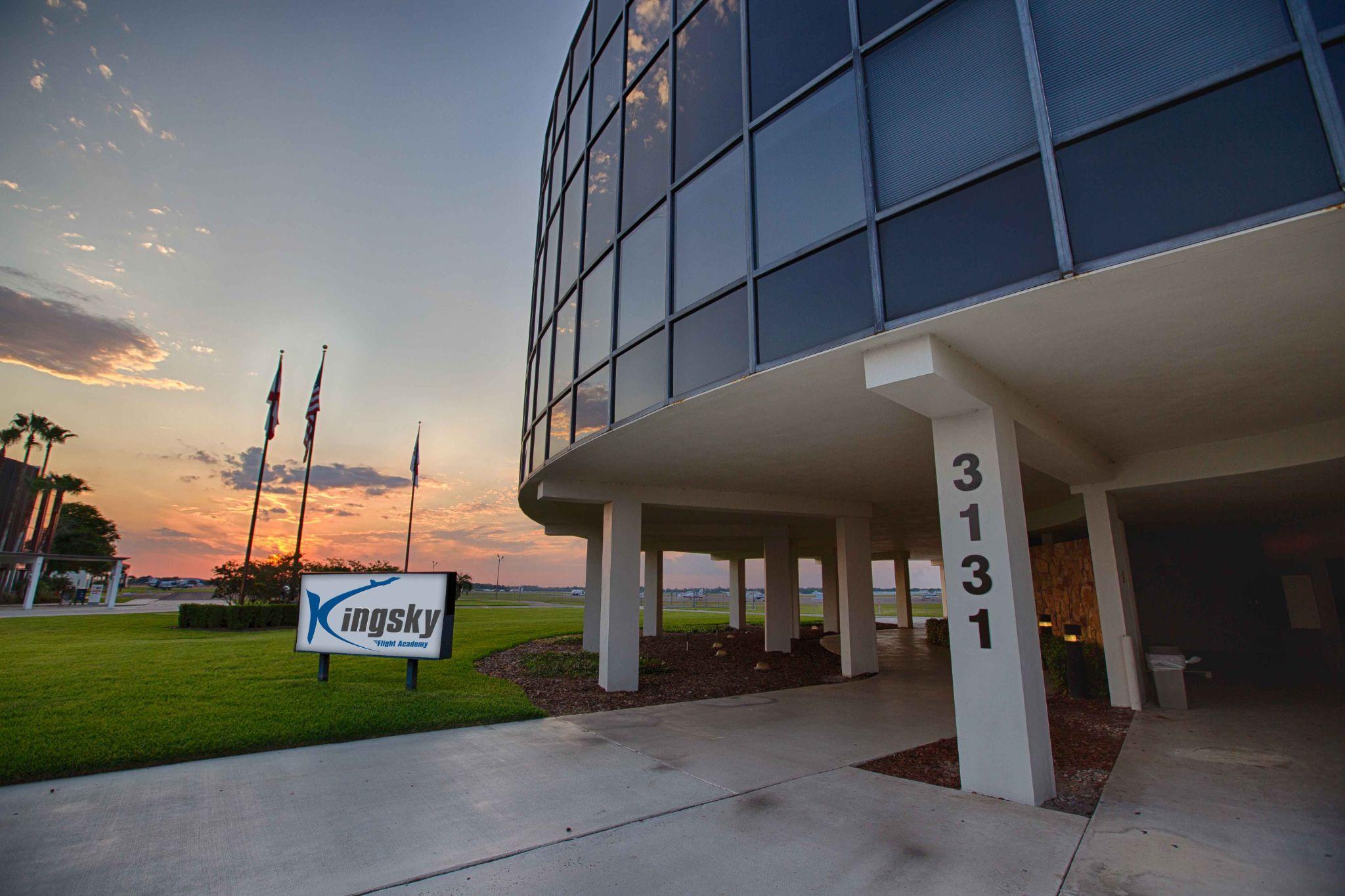 Kingsky Flight Academy with sunset in the background.