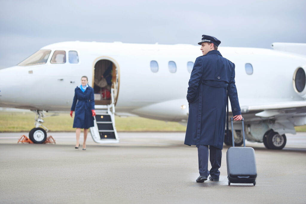 pilot walking towards airplane