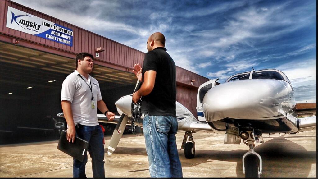 Plane, pilot, and student at Kingsky Flight Academy.