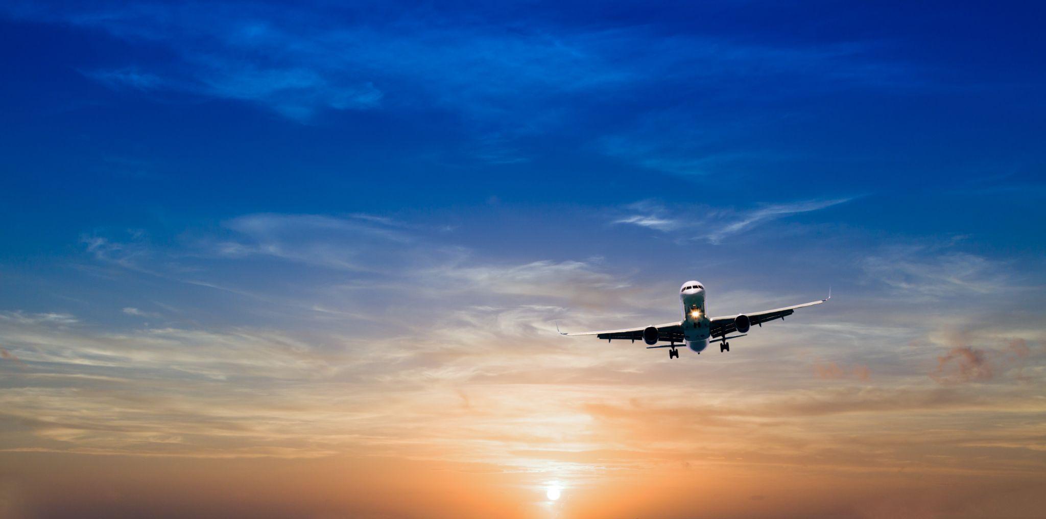 B737-500 flying in the sunset.