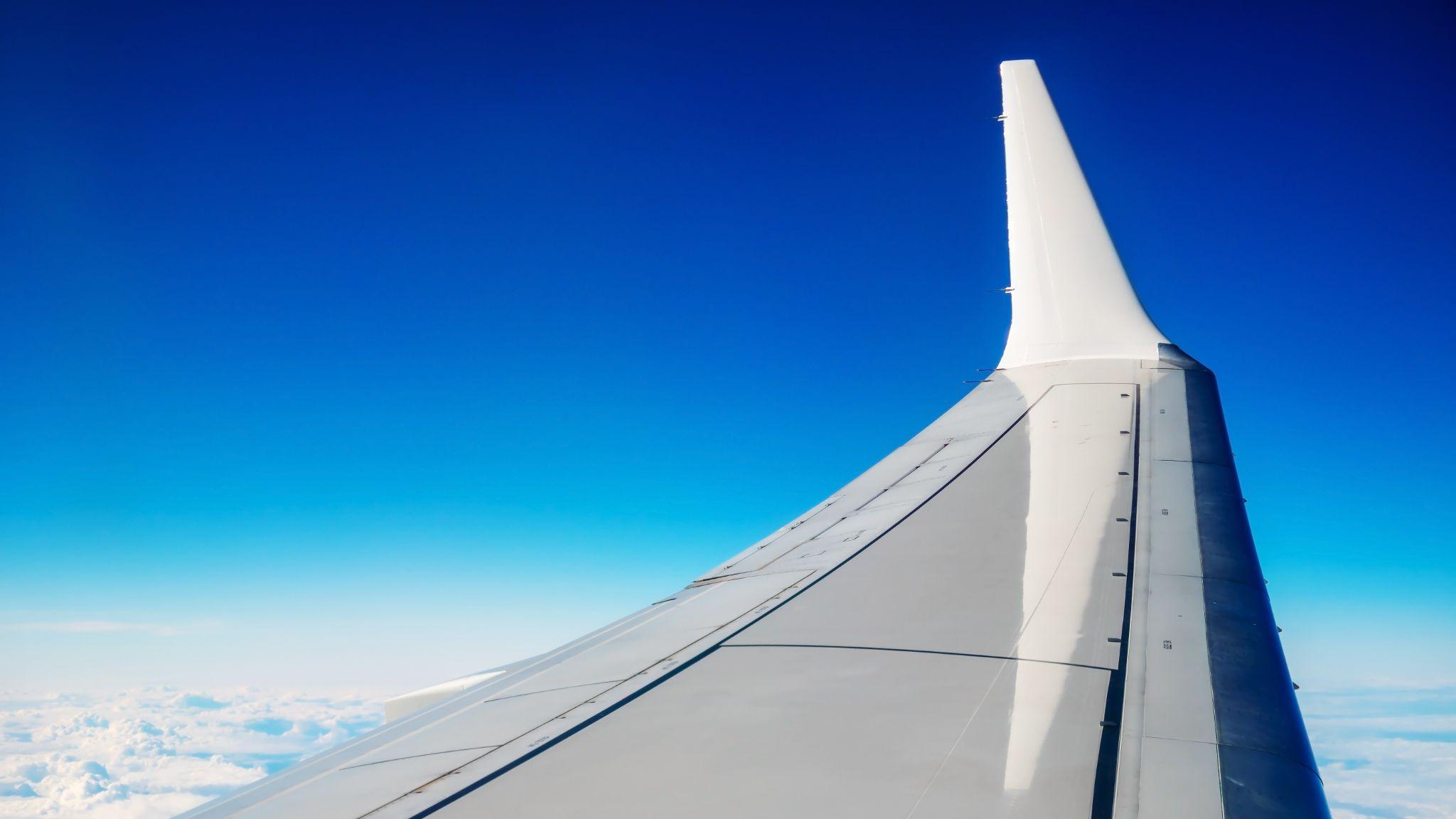 B737-500 wing above clouds.