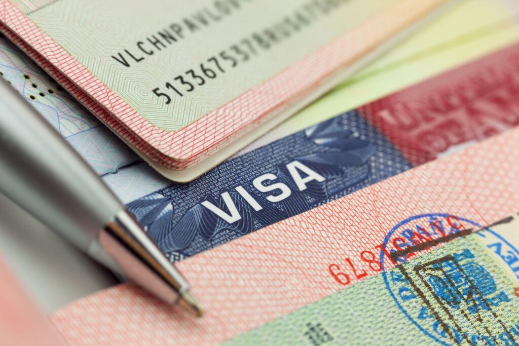 Different visas and stamps in a passport.