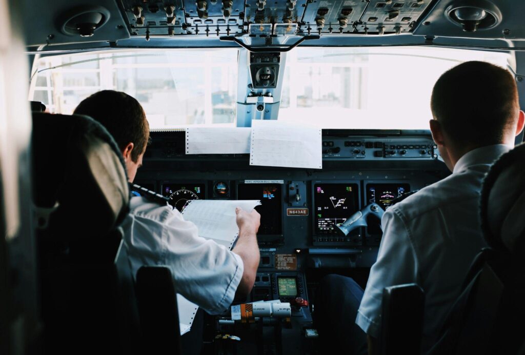 Pilots training in the cockpit, preparing pilots for an international pilot career.