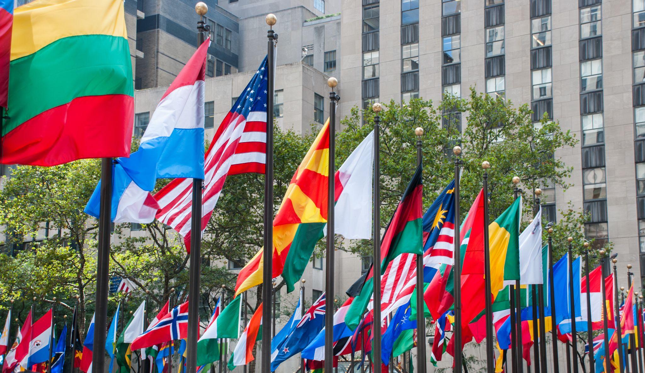 Rows of flags of all nations next to UN in New York City.