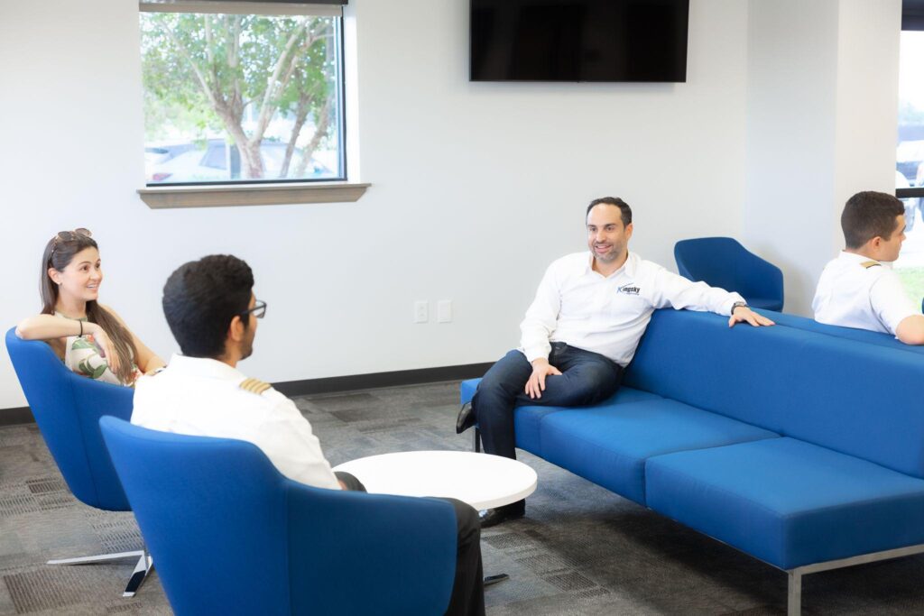Kingsky instructors meet with international students to discuss pilot training and M-1 visa requirements.
